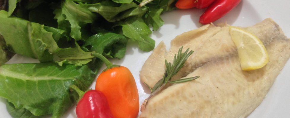 Thyme-lemon tilapia, mixed green salad and baby peppers